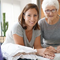 Egis Complete Care - Caregiver supporting client in their home.