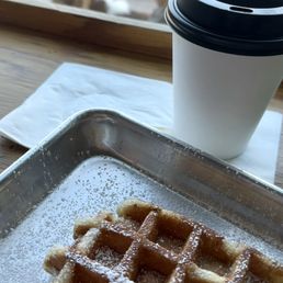 Warm waffle with coffee while people watching