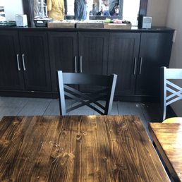 Empty napkin holders in the background, and dirty table. Empty napkin holders in the background, and dirty table.