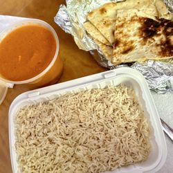 Backyard Pizza & Burgers - Butter chicken entree $15, added garlic naan $4, good portion and delicious, medium heat was pretty spicy !!