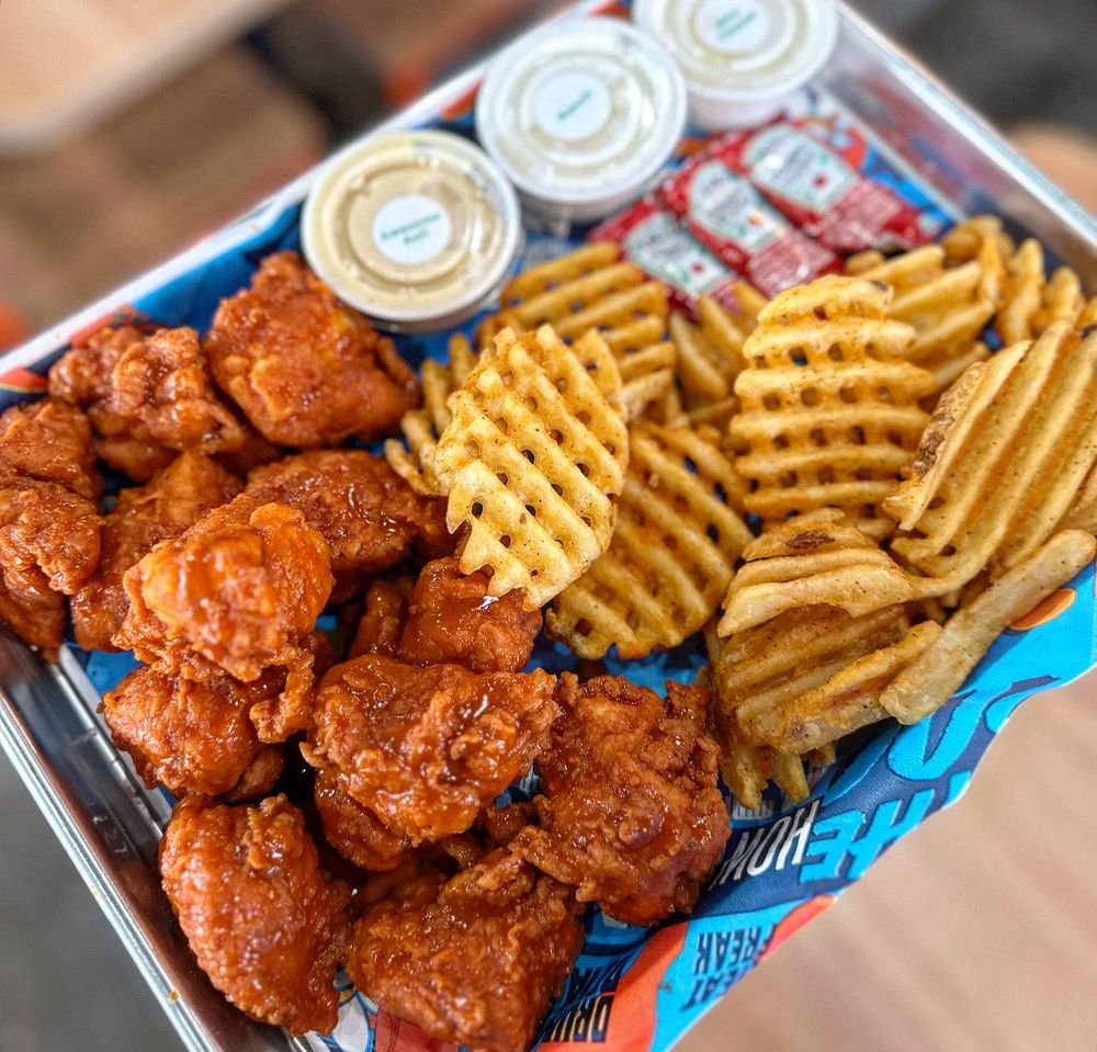 Atomic Wings Fairview Heights Logo
