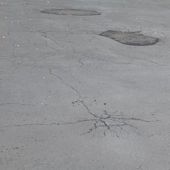Stan's Asphalt Paving - the hump and 2 holes he "filled" - Masonry/Concrete Near Me - Van Buren Twp, Michigan Stan's Asphalt Paving - the hump and 2 holes he "filled" - Masonry/Concrete Near Me - Van Buren Twp, Michigan