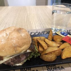 La Parrillada - Hamburger of the Txuletón with amazing caramelized onions and cheese and country fries