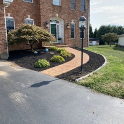 Horizon Outdoor Services - Complete transformation of front lawn with stone edging added