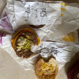 a hamburger and a bag of chips a hamburger and a bag of chips