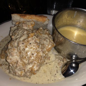 Jacob's Pickles - sausage gravy smothered chicken and cheesey grits - Comfort Food Near Me - New York, New York