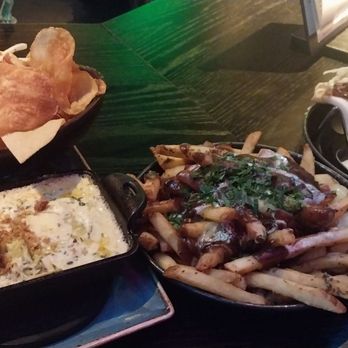 Puttshack - Philadelphia - Korean bao pulled pork tacos. Garlic fries with bacon gravy and hot crab dipp with house chips. - Mini Golf Near Me - Philadelphia, Pennsylvania