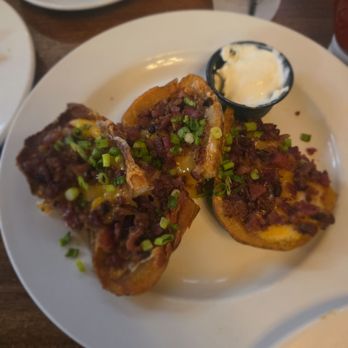 O'Malley's On Main - These potato skins are LOADED. Bacon, cheese, green onions, sour cream... no skimping here. One of the best I've had anywhere. - Irish Near Me - Seal Beach, California O'Malley's On Main - These potato skins are LOADED. Bacon, cheese, green onions, sour cream... no skimping here. One of the best I've had anywhere. - Irish Near Me - Seal Beach, California