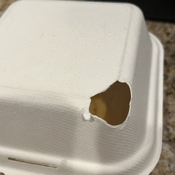 Yoshiya Kitchen - Hole in the egg roll container and it wasn't hot like the egg rolls burned it. - Ramen Near Me - Las Vegas, Nevada