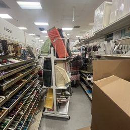 messy, unnavigable aisle that completely blocks anyone from coming through. Serious work safety risk. messy, unnavigable aisle that completely blocks anyone from coming through. Serious work safety risk.