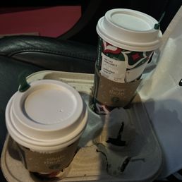 two cups of coffee on a tray