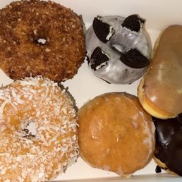 Cinnamon crumb, Coconut, Oreo, raspberry filled, maple bar and Boston cream donuts