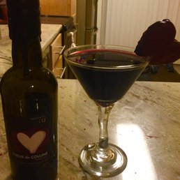 Couer de Colline 375 ml bottle at home in glass with chocolate truffle heart.