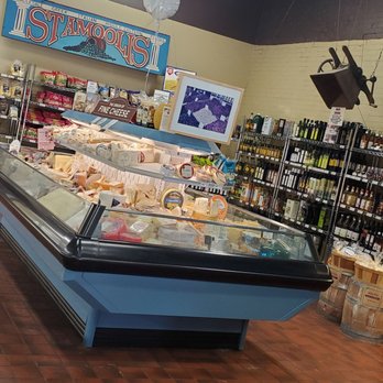 Stamoolis Brothers - a display of cheeses in a store - Grocery Near Me - Pittsburgh, Pennsylvania