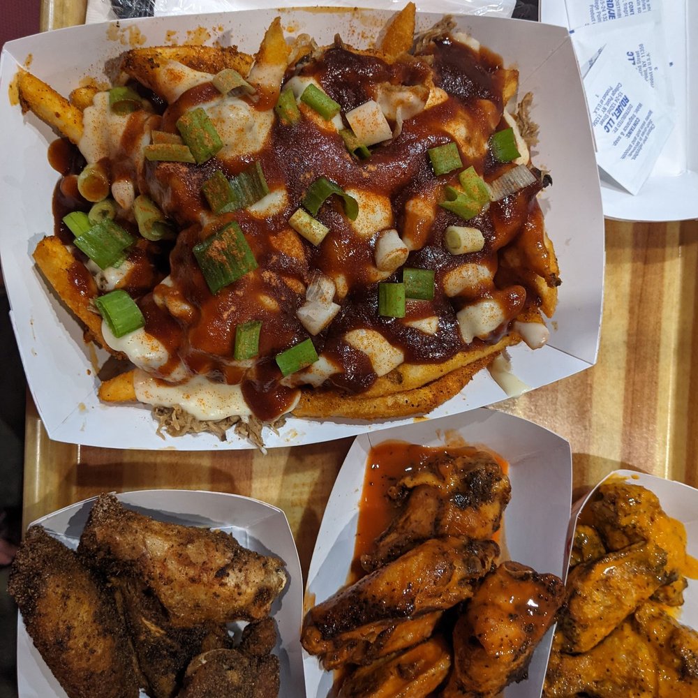 BBQ pork fries. Left to right wings: Jamaican dry rub, hot buffalo, and spicy garlic. BBQ pork fries. Left to right wings: Jamaican dry rub, hot buffalo, and spicy garlic.