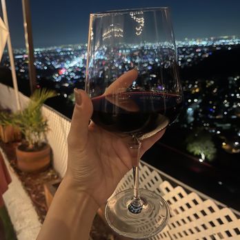 Orange Hill Restaurant & Events - Glass of wine with the city view - Steakhouses Near Me - Orange, California