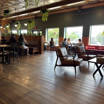 Uncommon Grounds - Nice big wide open eating area. Comfortably air-conditioned with comfy seats or regular dining tables or booths. - Bagels Near Me - Queensbury, New York Uncommon Grounds - Nice big wide open eating area. Comfortably air-conditioned with comfy seats or regular dining tables or booths. - Bagels Near Me - Queensbury, New York