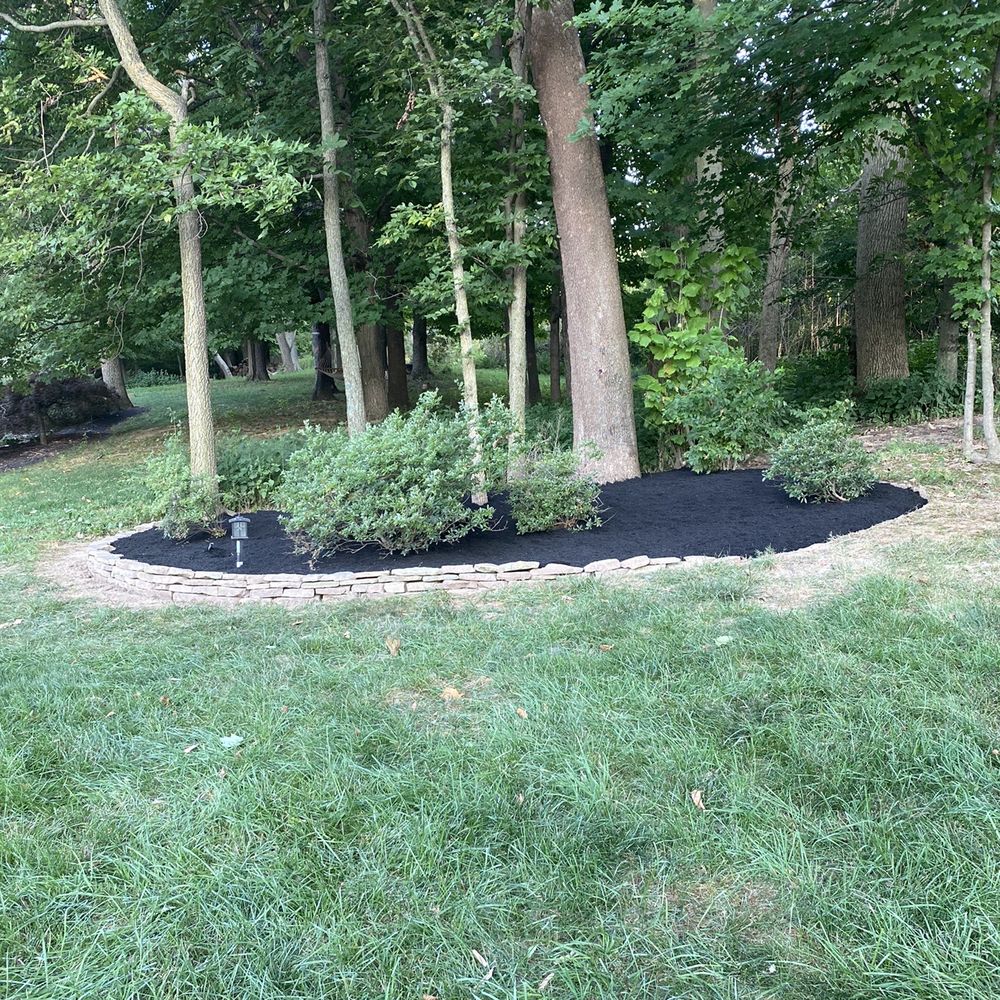 Mario’s Landscaping - a black mulch bed in a park - Lawn Services Near Me Mario’s Landscaping - a black mulch bed in a park - Lawn Services Near Me