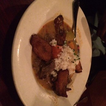 Highland Kitchen - Coconut curry goat with plantains and rice - New American Near Me - Somerville, Massachusetts