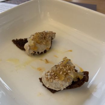 Cook Weaver - Complementary bites of tahini and orange peel - Modern European Near Me - Seattle, Washington