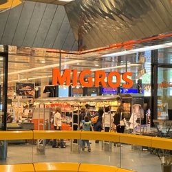 Migros - Follow the yellow. It's all the way at the end of this long mall off the north end of the airport.