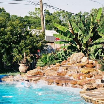 ABC Pools & Extreme Outdoors - a pool with a waterfall - General Contractors Near Me - Wimberly, Texas ABC Pools & Extreme Outdoors - a pool with a waterfall - General Contractors Near Me - Wimberly, Texas