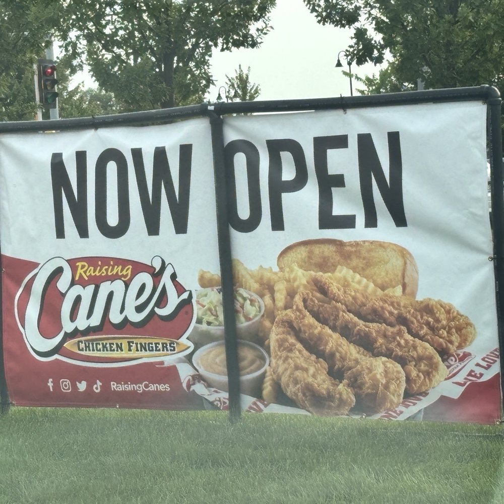Raising Cane's Chicken Fingers - Now open sign. Finally opened on July 30, 2024. - Fast Food Near Me - Greendale, Wisconsin Raising Cane's Chicken Fingers - Now open sign. Finally opened on July 30, 2024. - Fast Food Near Me - Greendale, Wisconsin