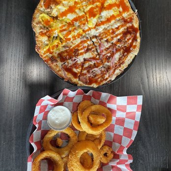 Copps Pizza - a plate of onion rings and a pizza - Pizza Near Me - Omaha, Nebraska Copps Pizza - a plate of onion rings and a pizza - Pizza Near Me - Omaha, Nebraska