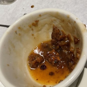 Half Shell Oyster House - What's left of the cinnamon roll bread pudding - Cajun/Creole Near Me - Mobile, Alabama