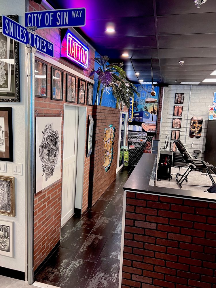 Smiles n Cries Tattoo Logo