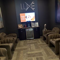 MassageLuXe - Waiting area for customers with free beverages such as teas and hot chocolates.
