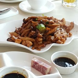朝陽飯莊 - Chicken, Lotus, and wild mushrooms wok stirred with a light soy sauce.