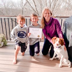 Caninekind - Millie graduates puppy manners training with the help of her mom and two big brothers.