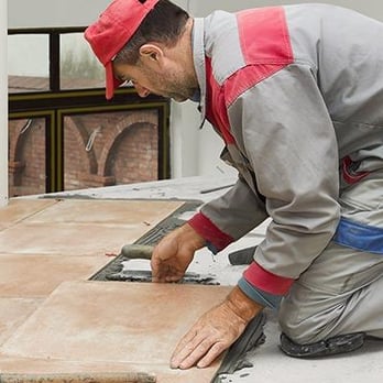Baker Floor Sanding & Installation - a man laying tile - Flooring Near Me - Travelers Rest, South Carolina Baker Floor Sanding & Installation - a man laying tile - Flooring Near Me - Travelers Rest, South Carolina