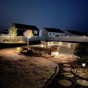 A. L. Landscaping - a landscaped yard at night - Landscaping Near Me - Madison, Wisconsin