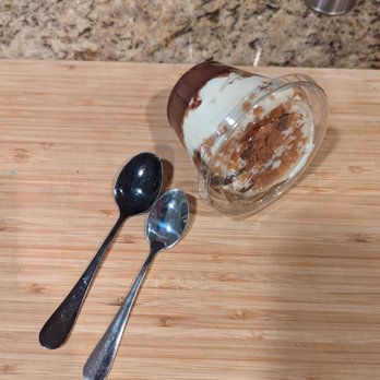 Jolene's Wings + Beer - The mousse we received. I used two different size spoons to show scale/comparison to the website photo. Over 50% of the container was whip. - Chicken Wings Near Me - Concord, California Jolene's Wings + Beer - The mousse we received. I used two different size spoons to show scale/comparison to the website photo. Over 50% of the container was whip. - Chicken Wings Near Me - Concord, California