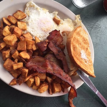 Potato Shack Cafe - Two eggs over easy, two bacon strips, one sausage patty, American fries deep fried and delicious sourdough toast! $9.75 - American Near Me - Encinitas, California Potato Shack Cafe - Two eggs over easy, two bacon strips, one sausage patty, American fries deep fried and delicious sourdough toast! $9.75 - American Near Me - Encinitas, California