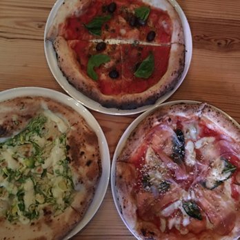 Lucia’s Berkeley - Bottom left is white sauce - Brussels sprouts and lemon. Bottom right is red sauce - speck of love. Top right - neopolitan - Pizza Near Me - Berkeley, California