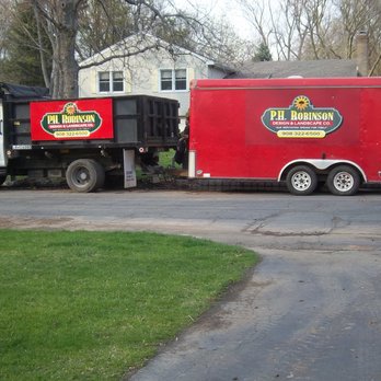 PHR Landscapes - a truck and trailer parked on a residential street - Landscape Architects or Designers Near Me - Scotch Plains, New Jersey PHR Landscapes - a truck and trailer parked on a residential street - Landscape Architects or Designers Near Me - Scotch Plains, New Jersey