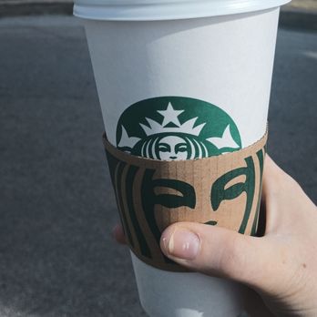 Starbucks - a hand holding a starbucks cup - Coffee & Tea Near Me - Wentzville, Missouri Starbucks - a hand holding a starbucks cup - Coffee & Tea Near Me - Wentzville, Missouri