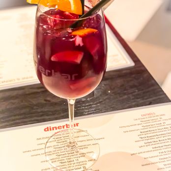 Dinerbar - a glass of red wine with a slice of orange - Diners Near Me - Rego Park, New York Dinerbar - a glass of red wine with a slice of orange - Diners Near Me - Rego Park, New York
