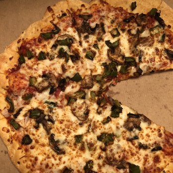 daVido's Pizza & Wings - a half eaten pizza - Pizza Near Me - Lithonia, Georgia