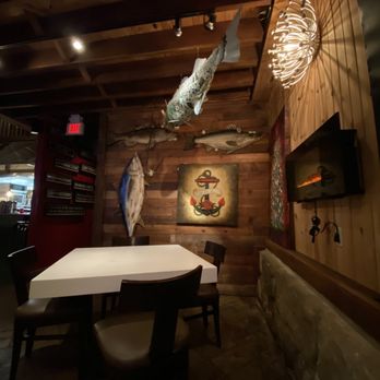 Strip Steakhouse - a dining room with a table and chairs - Steakhouses Near Me - Avon, Ohio
