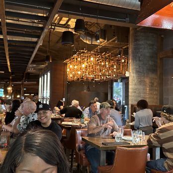 Kellys Landing - people sitting at tables in a restaurant - Sports Bars Near Me - Toronto, Ontario