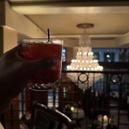 My drink with the restaurant in the background. Drinks here are excellent too.