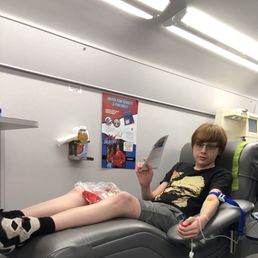 The boy donating.