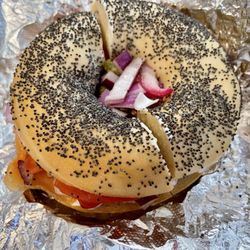The Bagel Bin & Hoagie House - Nova lox and cream cheese, onions,  tomatoes and capers, on a freshly-made toasted poppyseed bagel