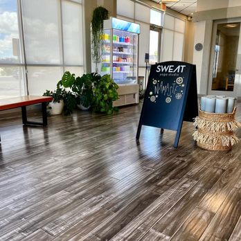 SWEAT Yoga Studio - Front lobby with drink cooler. - Yoga Near Me - Albuquerque, New Mexico