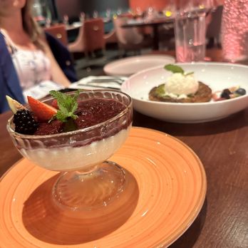 Lokum - a woman sitting at a table with a dessert in front of her - Salad Near Me - Brooklyn, New York Lokum - a woman sitting at a table with a dessert in front of her - Salad Near Me - Brooklyn, New York