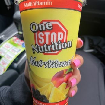 One Stop Nutrition - a hand holding a cup of juice - Juice Bars & Smoothies Near Me - Surprise, Arizona One Stop Nutrition - a hand holding a cup of juice - Juice Bars & Smoothies Near Me - Surprise, Arizona